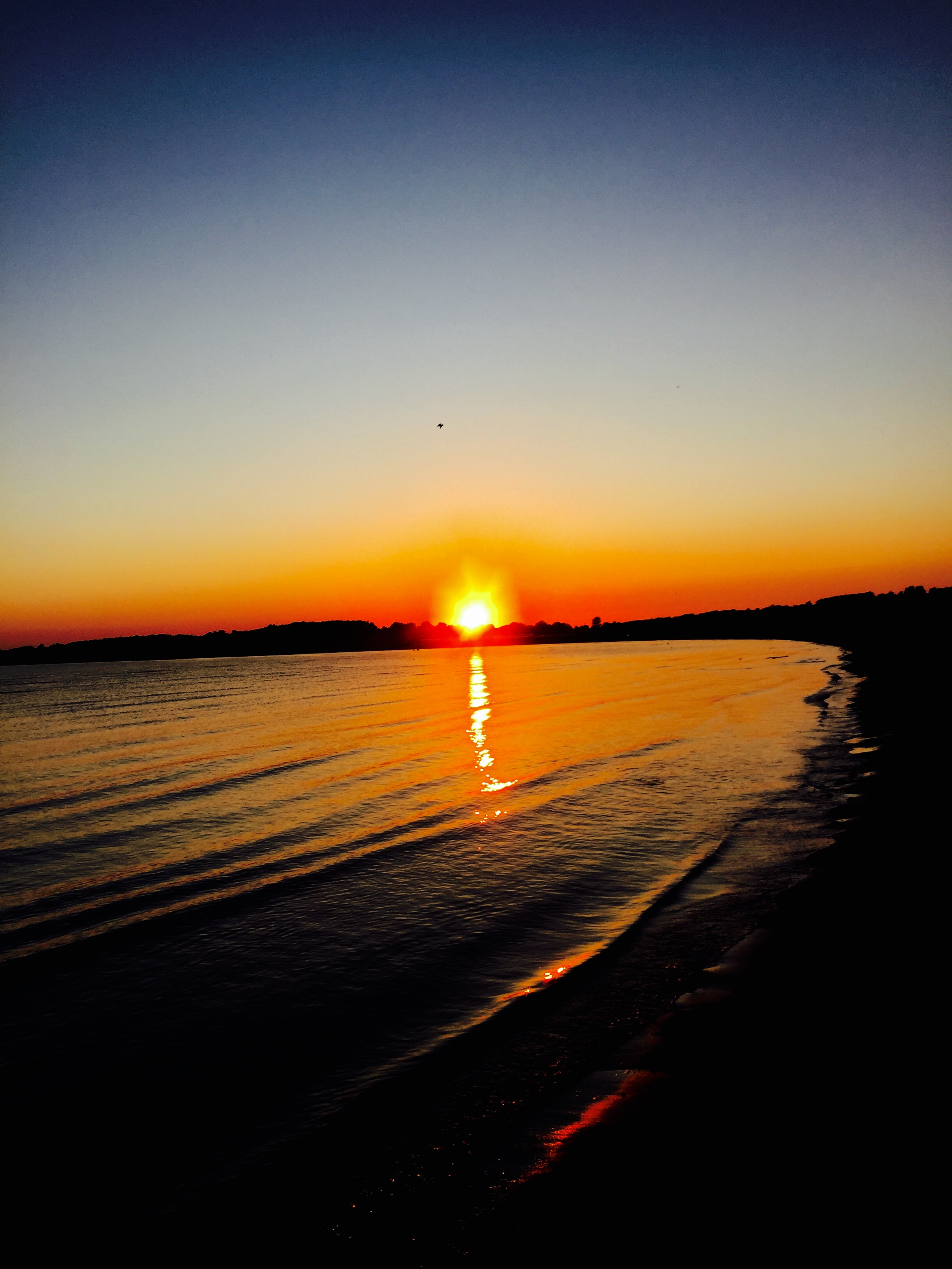 Solnedgang over Varberg og Apelviken.